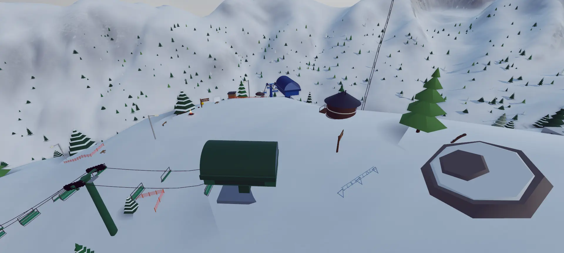 Lift terminals, park features, and buildings on a snowy Snowbox mountain.